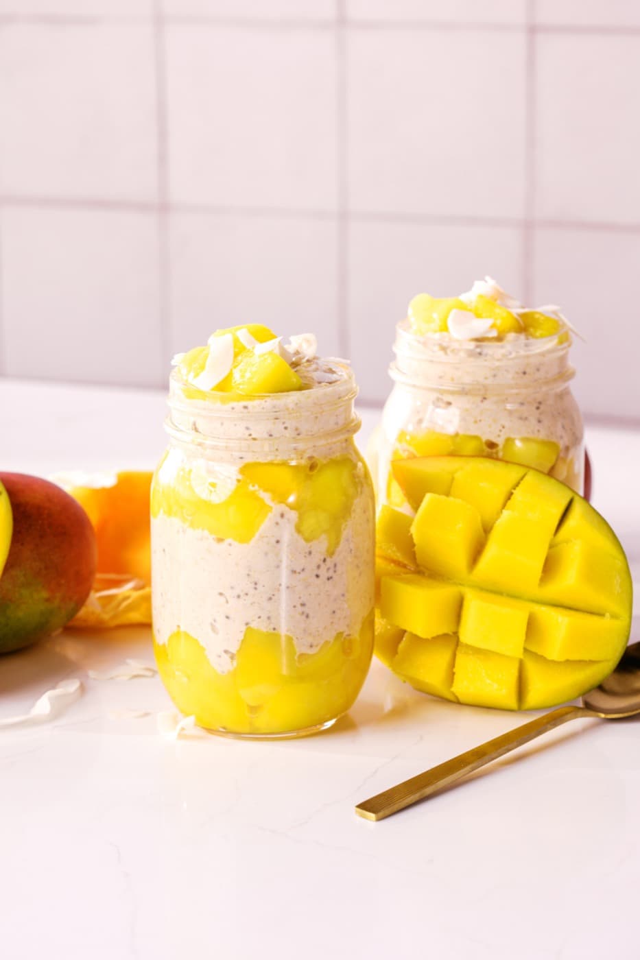 Mango coconut overnight oats with fruit and coconut.