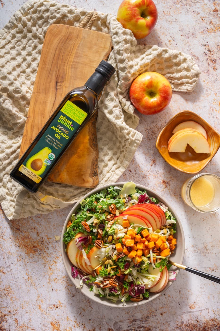 A salad made with avocado oil and fresh vegetables.